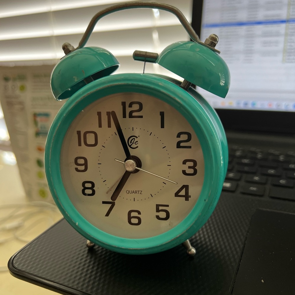 Adorable antique turquoise clock just needs a new battery. Triple A.
